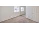 Well-lit bedroom with mirrored closet doors and carpet flooring at 2423 Tottingham Rd, Henderson, NV 89074