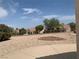 Spacious backyard with gravel and a small garden at 2532 Big Timber Dr, Las Vegas, NV 89134