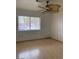 Bright bedroom with ceiling fan and laminate flooring at 2532 Big Timber Dr, Las Vegas, NV 89134