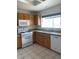 Galley kitchen with wood cabinets and granite countertops at 2532 Big Timber Dr, Las Vegas, NV 89134