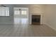 Bright living room with tiled floors and fireplace at 2532 Big Timber Dr, Las Vegas, NV 89134