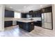 Modern kitchen with island and stainless steel appliances at 3026 Coveri Ct, Las Vegas, NV 89141