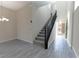 Modern staircase with dark wood railing in home at 3026 Coveri Ct, Las Vegas, NV 89141