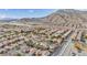 Aerial view of a residential neighborhood nestled in a valley, surrounded by mountains at 3728 Russell Peterson Ct, Las Vegas, NV 89129