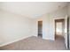 Well-lit bedroom with ample closet space and carpet flooring at 4608 Snake Eyes St # 102, Las Vegas, NV 89122