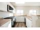 Bright kitchen featuring stainless steel appliances and an island at 4608 Snake Eyes St # 102, Las Vegas, NV 89122