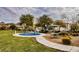 Community playground with rainbow climber and picnic tables at 4608 Snake Eyes St # 102, Las Vegas, NV 89122