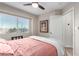 Bright bedroom with a comfortable queen bed and large window at 500 Sutters Mill Rd, Henderson, NV 89014