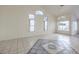 Bright living room with tile floors, high ceilings and large windows at 5529 Cypress Creek St, North Las Vegas, NV 89031