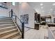 Spacious entryway with modern staircase and a view of the kitchen at 6481 Farness St, Las Vegas, NV 89135