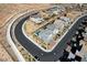 Aerial view of neighborhood with houses and curved street at 6481 Farness St, Las Vegas, NV 89135