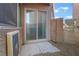 Small backyard patio with sliding glass door access at 6837 Dragonfly Rock St, Las Vegas, NV 89148