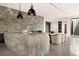 Large kitchen island made of a single piece of granite at 6860 Milos Rd, Las Vegas, NV 89118