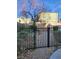 Small backyard with gravel and a metal fence at 7071 Canary Ivy Way, Las Vegas, NV 89156