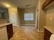 Bright kitchen with ample cabinetry and tile flooring at 8679 Tom Noon Ave # 102, Las Vegas, NV 89178