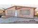 House exterior showcasing a light pink facade and front entrance at 887 W Carey Ave, North Las Vegas, NV 89030