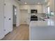 Modern kitchen with white shaker cabinets and quartz countertops at 8916 Desert Mound Dr, Las Vegas, NV 89134