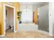 Luxurious bathroom with soaking tub, walk-in shower, and separate toilet at 9990 Four Views St, Las Vegas, NV 89143