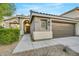 Front view of a charming single story house with a two-car garage at 10369 Niagara Falls Ln, Las Vegas, NV 89144