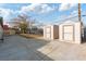 Two storage sheds in a large backyard with concrete slab at 108 Metropolitan Dr, Henderson, NV 89015