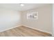 Bright bedroom with wood-look flooring and a window at 108 Metropolitan Dr, Henderson, NV 89015