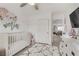 Bright Bedroom with crib, closet, and view to another room at 11009 Pentland Downs St, Las Vegas, NV 89141