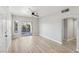 Bright living room featuring light gray walls and wood-look flooring at 2201 Ramsgate Dr # 327, Henderson, NV 89074