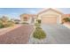 Single-story house with desert landscaping and two-car garage at 2652 Youngdale Dr, Las Vegas, NV 89134