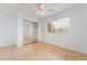 Bright bedroom with mirrored closet and a window with blinds at 411 Opal Dr, Henderson, NV 89015