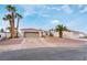 Single-story home with desert landscaping and two-car garage at 411 Opal Dr, Henderson, NV 89015