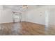 Spacious living room with wood-look tile floors and ceiling fan at 411 Opal Dr, Henderson, NV 89015