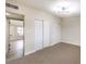 Bedroom with carpet, double closets and access to another room at 5520 Morendo Dr, Las Vegas, NV 89107