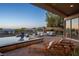 Relaxing pool area with lounge chairs and a fire pit at 73 Kittansett Loop, Henderson, NV 89052