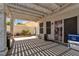 Covered patio with grill and backyard access at 7809 Cocoa Beach Cir, Las Vegas, NV 89128