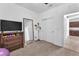 Versatile bedroom with a dresser, full-length mirror, and sliding door closet at 9183 Lynea Ct, Las Vegas, NV 89178