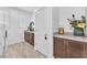 Bright laundry room with washer, dryer, cabinets, and granite countertops at 9183 Lynea Ct, Las Vegas, NV 89178