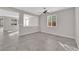 Open living room features tile floors and a view into the kitchen at 10223 Aragon Crown Rd, Las Vegas, NV 89135