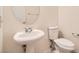 Clean bathroom with pedestal sink and toilet at 11174 Ranch Valley St, Las Vegas, NV 89179