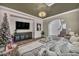 Living room with hardwood floors, fireplace and view of staircase at 11372 Corsica Mist Ave, Las Vegas, NV 89135