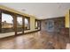 Bright bonus room with stone wall and wood floors at 2215 Alcova Ridge Dr, Las Vegas, NV 89135