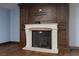 Modern fireplace with dark wood mantel and hearth at 2215 Alcova Ridge Dr, Las Vegas, NV 89135