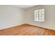 Bright bedroom with wood-look floors and window at 2645 S Durango Dr # 101, Las Vegas, NV 89117