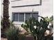 Close-up view of building exterior with cacti and desert plants at 2725 S Nellis Blvd # 1071, Las Vegas, NV 89121