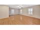 Hardwood floor living room with ceiling fan and window shutters at 319 Fox Lake Ave, Las Vegas, NV 89148