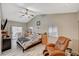 Primary bedroom with high ceilings, sliding door to patio, and a ceiling fan at 3464 Trilogy Dr, Las Vegas, NV 89108