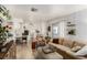 Open living room with beige couch and view into kitchen area at 3540 Haleakala Dr, Las Vegas, NV 89122