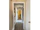 Bright hallway with wood-look flooring and access to bedrooms at 4143 Laurel Park Ave, Las Vegas, NV 89103