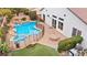 Large pool with spa and fire pit, surrounded by a fenced yard at 4332 Val Dechiana Ave, Las Vegas, NV 89141