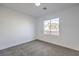 Bright bedroom featuring a window and grey carpet at 4623 Harvest Night St, Las Vegas, NV 89129