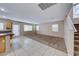 Open living room and kitchen with carpeted floor and tile at 6535 Mocha Brown Ct, Las Vegas, NV 89118